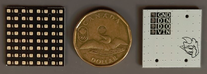 Two LED arrays showing the top and bottom of the PCB, with a Canadian loonie for scale.